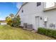 Home's exterior showcasing AC units and a storage room at 3431 Chestertown Loop, Bradenton, FL 34211