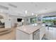 Kitchen island with seating and view to backyard and pool at 3431 Chestertown Loop, Bradenton, FL 34211