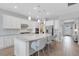 White kitchen with granite countertops and stainless steel appliances at 3431 Chestertown Loop, Bradenton, FL 34211