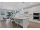 Spacious kitchen with white cabinets, granite countertops, and island at 3431 Chestertown Loop, Bradenton, FL 34211