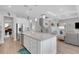 Large kitchen island with white cabinets and granite countertops at 3431 Chestertown Loop, Bradenton, FL 34211