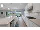 Open concept kitchen with long island and gas stove at 3431 Chestertown Loop, Bradenton, FL 34211