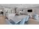 Modern kitchen with large island and open dining area at 3431 Chestertown Loop, Bradenton, FL 34211