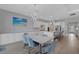 Open concept kitchen and dining space with modern white cabinetry at 3431 Chestertown Loop, Bradenton, FL 34211