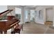 Living room with grand piano and access to entry at 3431 Chestertown Loop, Bradenton, FL 34211