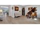 Living room featuring a grand piano and seating area at 3431 Chestertown Loop, Bradenton, FL 34211