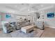 Bright and airy living room with gray sofas and a large coffee table at 3431 Chestertown Loop, Bradenton, FL 34211