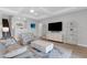 Spacious living room with comfortable seating and a large TV at 3431 Chestertown Loop, Bradenton, FL 34211