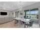 Open concept living and dining area with a view of the pool and patio at 3431 Chestertown Loop, Bradenton, FL 34211