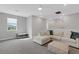 Bright loft area with sectional sofa and ottoman at 3431 Chestertown Loop, Bradenton, FL 34211