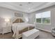 Bright bedroom with large window and seating at 3431 Chestertown Loop, Bradenton, FL 34211