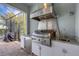 Modern outdoor kitchen with stainless steel appliances at 3431 Chestertown Loop, Bradenton, FL 34211