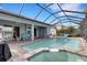 Relaxing pool and spa with covered patio and outdoor dining at 3431 Chestertown Loop, Bradenton, FL 34211