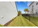 Landscaped side yard with a view of the lake at 3431 Chestertown Loop, Bradenton, FL 34211