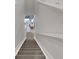 Modern staircase with gray carpeting, leading to living area at 3431 Chestertown Loop, Bradenton, FL 34211