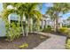 Brick walkway leading to the front entrance, bordered by lush landscaping at 3431 Chestertown Loop, Bradenton, FL 34211
