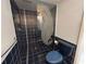 Bathroom with shower and blue tile at 3725 Glen Oaks Manor Dr, Sarasota, FL 34232