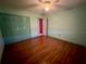 Bright bedroom with wood floors and double door closet at 3725 Glen Oaks Manor Dr, Sarasota, FL 34232