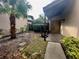 Inviting front entry with a paved walkway and a small garden at 3725 Glen Oaks Manor Dr, Sarasota, FL 34232
