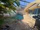 Enclosed pool and spa with painted mural at 3725 Glen Oaks Manor Dr, Sarasota, FL 34232