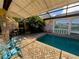 Enclosed pool and spa with painted mural at 3725 Glen Oaks Manor Dr, Sarasota, FL 34232