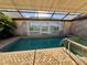 Enclosed pool area with a spa and painted mural at 3725 Glen Oaks Manor Dr, Sarasota, FL 34232