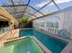 Enclosed pool and spa with painted mural at 3725 Glen Oaks Manor Dr, Sarasota, FL 34232