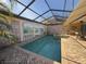 Enclosed pool and spa with painted mural at 3725 Glen Oaks Manor Dr, Sarasota, FL 34232