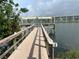 Wooden dock offering scenic waterfront views at 3749 Lake Bayshore Dr # 303, Bradenton, FL 34205