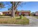 Well-maintained single-story home with a large yard and driveway at 3807 64Th St W, Bradenton, FL 34209