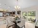 Kitchen and dining area with modern chandelier and view of the backyard at 4050 Dragon Street St, North Port, FL 34288