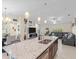 Open kitchen features granite island with seating and a view into the living room at 4050 Dragon Street St, North Port, FL 34288