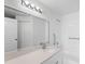 Clean bathroom with a large mirror, single sink vanity, and a bathtub at 4152 Central Sarasota Pkwy # 727, Sarasota, FL 34238