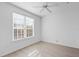 Bright bedroom with large window and ceiling fan at 4152 Central Sarasota Pkwy # 727, Sarasota, FL 34238