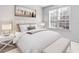 Comfortable bedroom with a queen-size bed, nightstands, and plenty of natural light at 4152 Central Sarasota Pkwy # 727, Sarasota, FL 34238