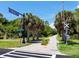 Scenic bike path near railroad crossing, lined with palm trees at 4152 Central Sarasota Pkwy # 727, Sarasota, FL 34238