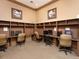 Business center with computers, desks, and comfortable seating at 4152 Central Sarasota Pkwy # 727, Sarasota, FL 34238