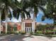Community center with lush landscaping and palm trees at 4152 Central Sarasota Pkwy # 727, Sarasota, FL 34238