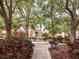 Landscaped courtyard with fountain and walking path at 4152 Central Sarasota Pkwy # 727, Sarasota, FL 34238