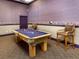 Game room with billiard table and comfortable seating at 4152 Central Sarasota Pkwy # 727, Sarasota, FL 34238