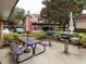 Outdoor grilling area with picnic tables and gas grills at 4152 Central Sarasota Pkwy # 727, Sarasota, FL 34238