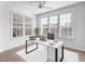 Spacious home office with a large desk, plenty of natural light, and ample space at 4152 Central Sarasota Pkwy # 727, Sarasota, FL 34238
