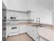 Clean kitchen with white cabinets, stainless steel appliances, and ample counter space at 4152 Central Sarasota Pkwy # 727, Sarasota, FL 34238