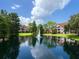 Serene pond with a central fountain and lush greenery at 4152 Central Sarasota Pkwy # 727, Sarasota, FL 34238