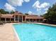 Inviting community pool with surrounding lounge chairs at 4152 Central Sarasota Pkwy # 727, Sarasota, FL 34238