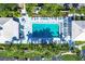 Aerial view of community pool with surrounding lounge chairs at 431 Cerromar Ln # 446, Venice, FL 34293
