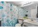 Clean bathroom with seashell shower curtain and updated vanity at 431 Cerromar Ln # 446, Venice, FL 34293