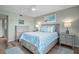 Serene bedroom with gray platform bed and blue bedding at 431 Cerromar Ln # 446, Venice, FL 34293