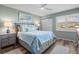 Bright bedroom with gray platform bed and blue bedding at 431 Cerromar Ln # 446, Venice, FL 34293