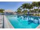 Refreshing community pool with plenty of lounge chairs for relaxing at 431 Cerromar Ln # 446, Venice, FL 34293